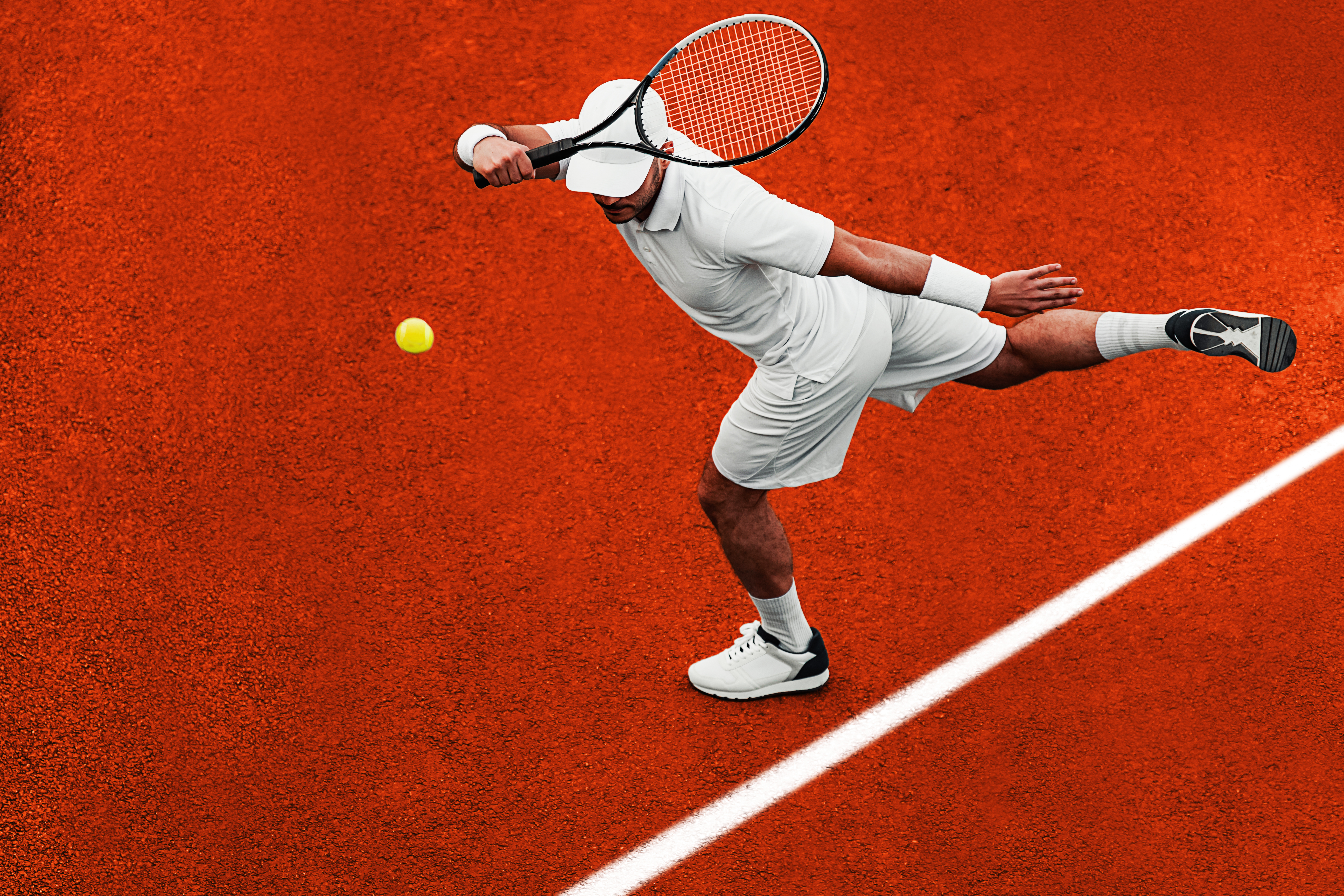 Tennis player striking a tennis ball
