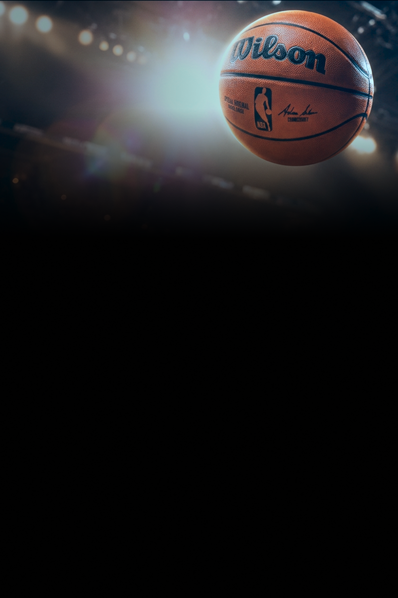 Official NBA Finals basketball suspended in midair beneath bright arena lights, capturing the excitement and atmosphere of championship basketball. The dramatic sports scene highlights the intensity of the NBA Finals and professional basketball competition.