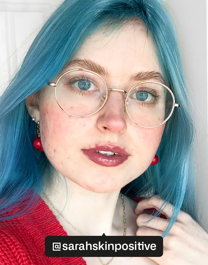 girl with blue hair and make up applied