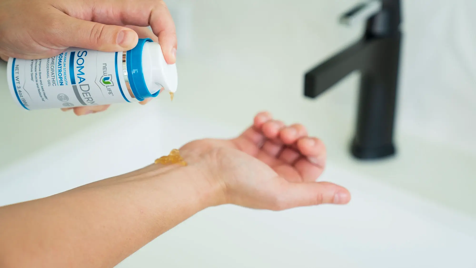 Image of someone applying SomaDerm to their wrist