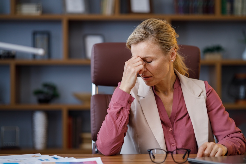 tired-businesswoman-after-exhausting-paperwork-tak-2024-12-05-20-24-38-utc