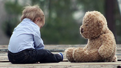 toddler with bear