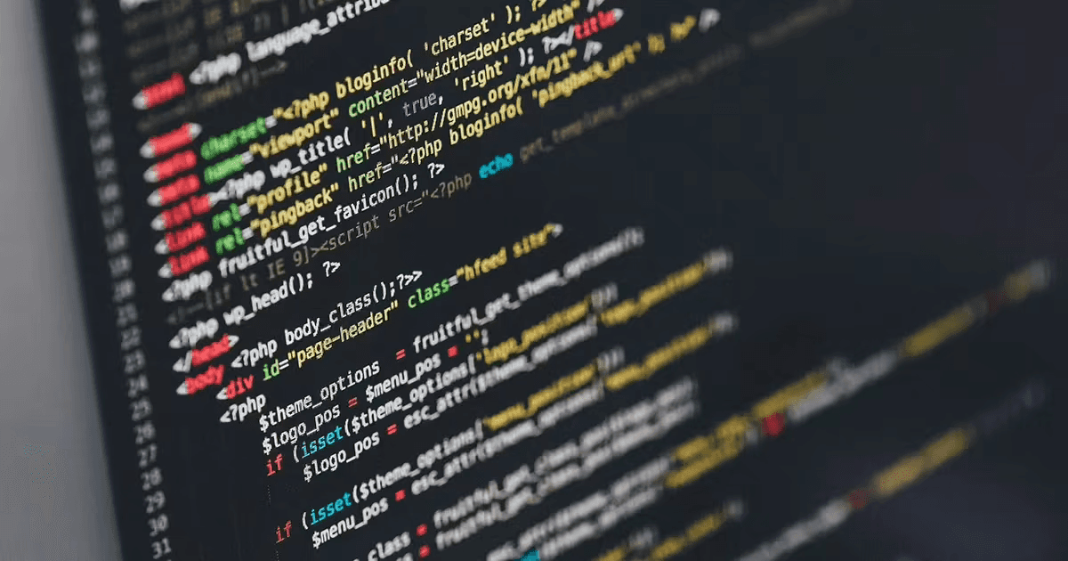 Close-up of a computer screen displaying lines of code in various programming languages.