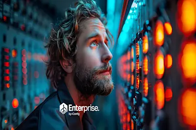 A man with a beard and curly hair looks thoughtfully at a glowing control panel in a dimly lit room. The scene is framed by orange and blue lights. A logo reads “Enterprise by Config.” The mood is focused and contemplative.