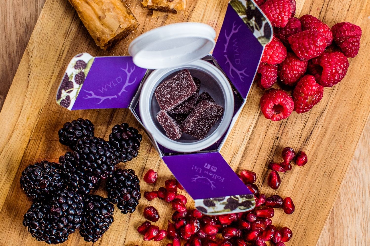 Marionberry gummies on fruit board