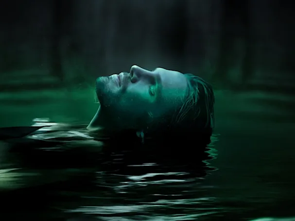 man floating on water