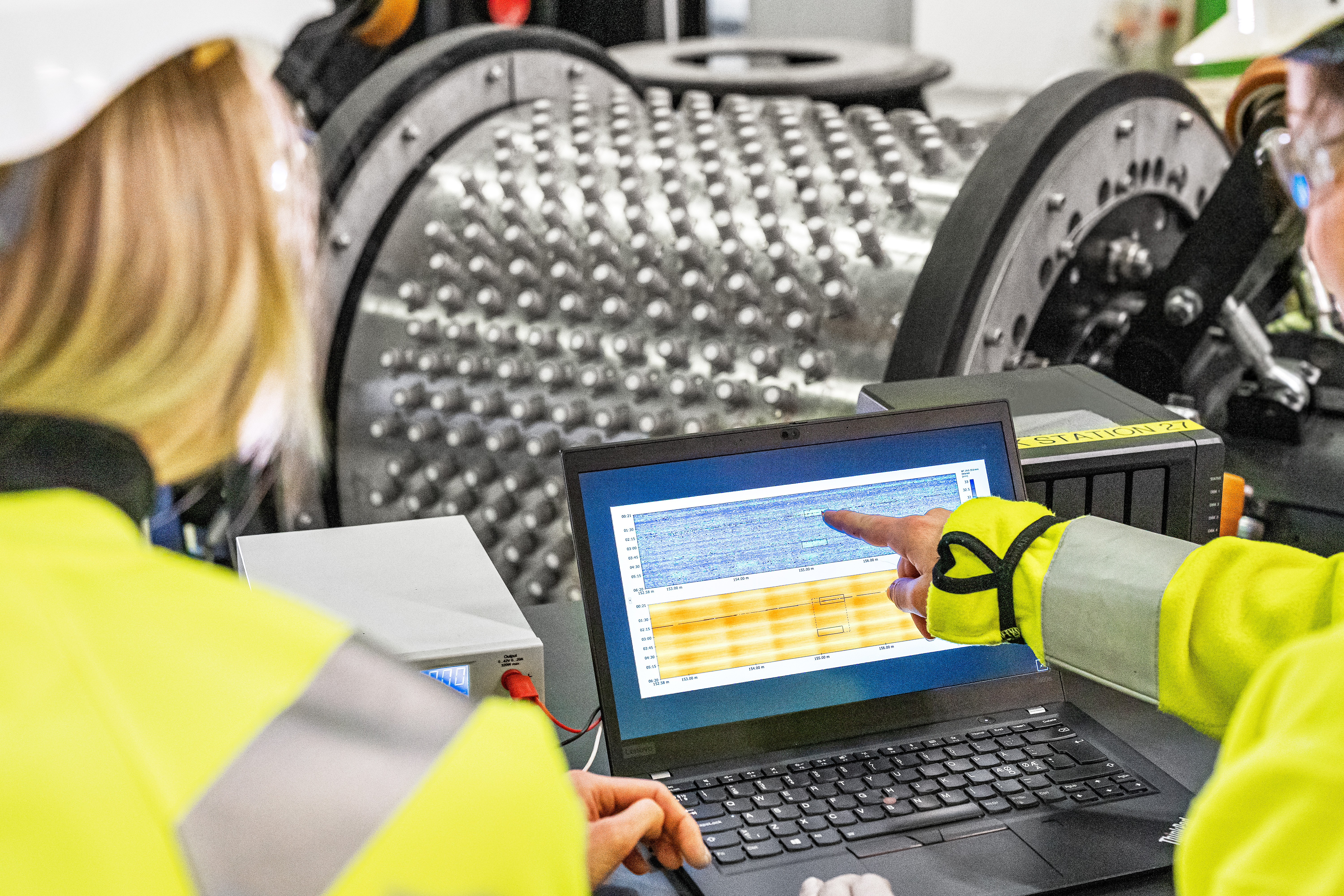 Employees viewing data next to ART Scan tool