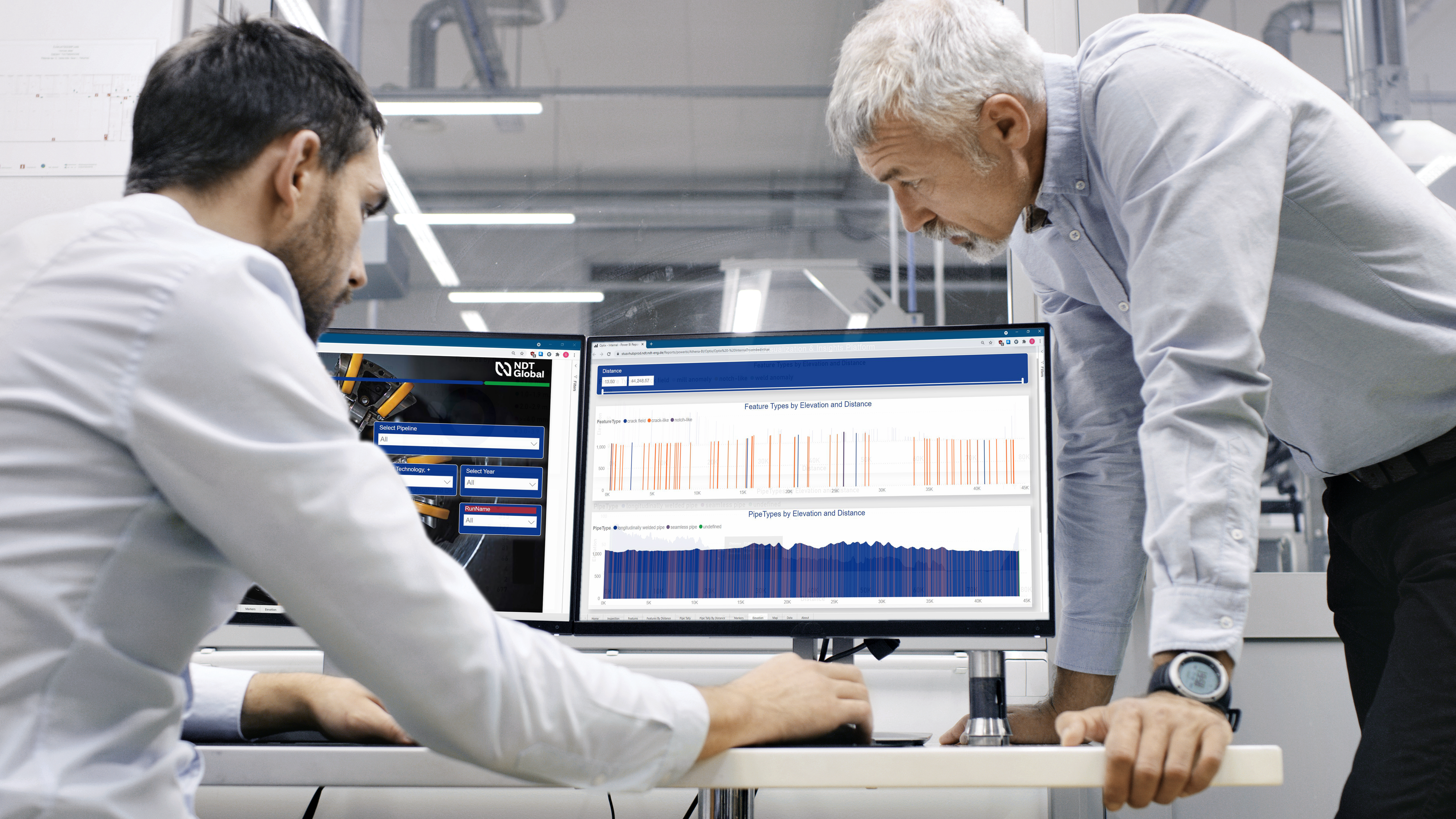 Two men looking at OPTIX screens