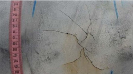Up close view of a crack and ruler