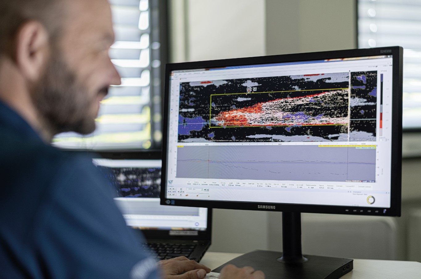 Image of an NDT Global employee viewing a fitness for purpose assessment