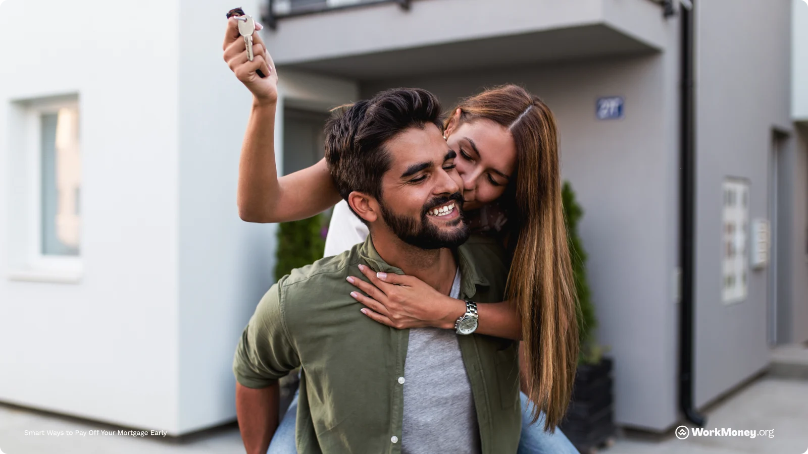 Happy couple celebrating their house purchase closing