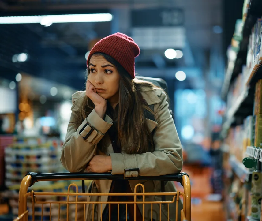 Sad shopper with grocery cart