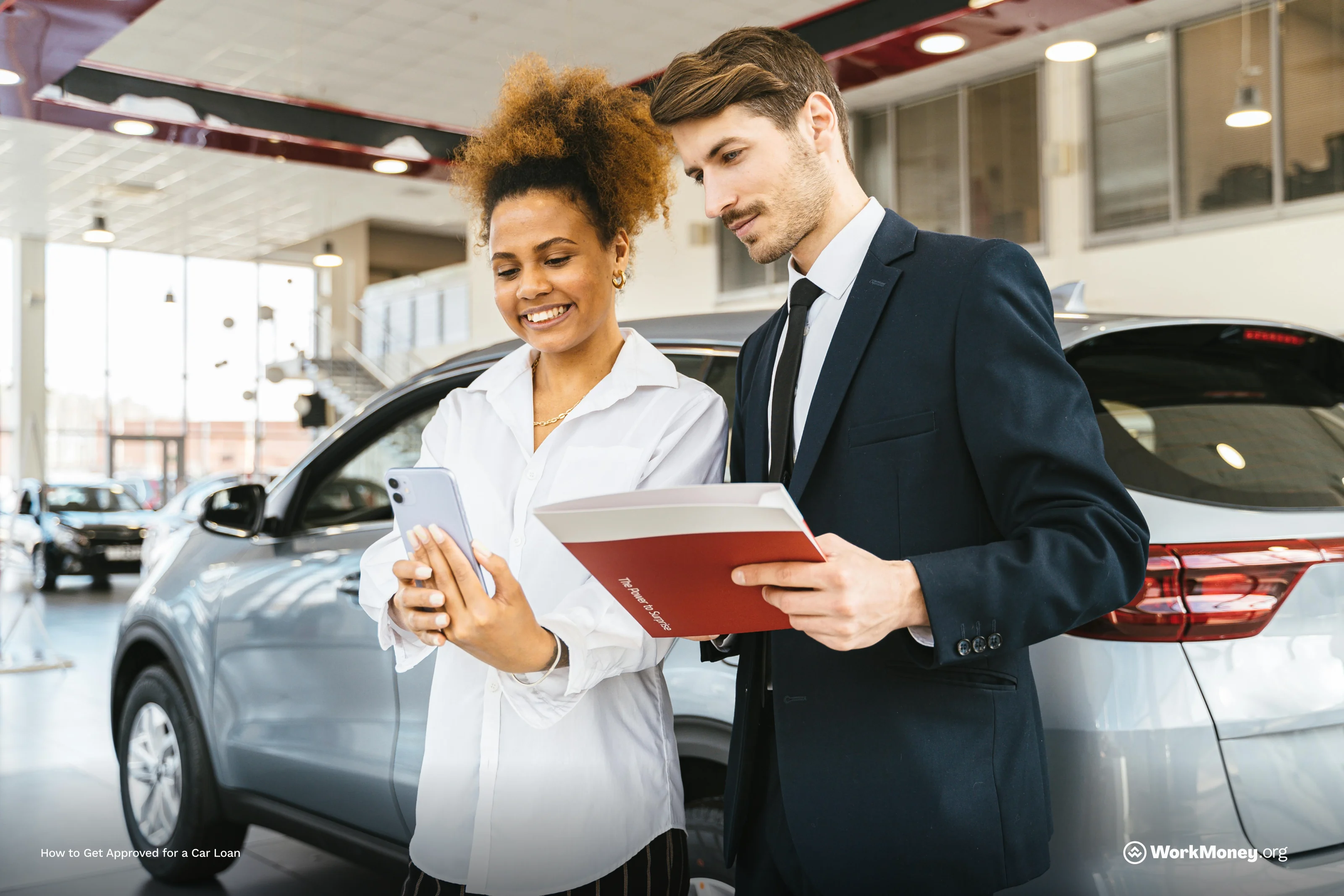 Lady with car salesman at a car dealership