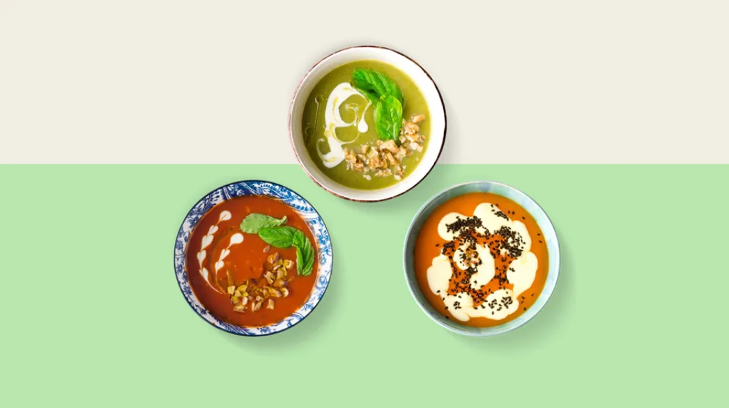 Three bowls of soup are offered up.