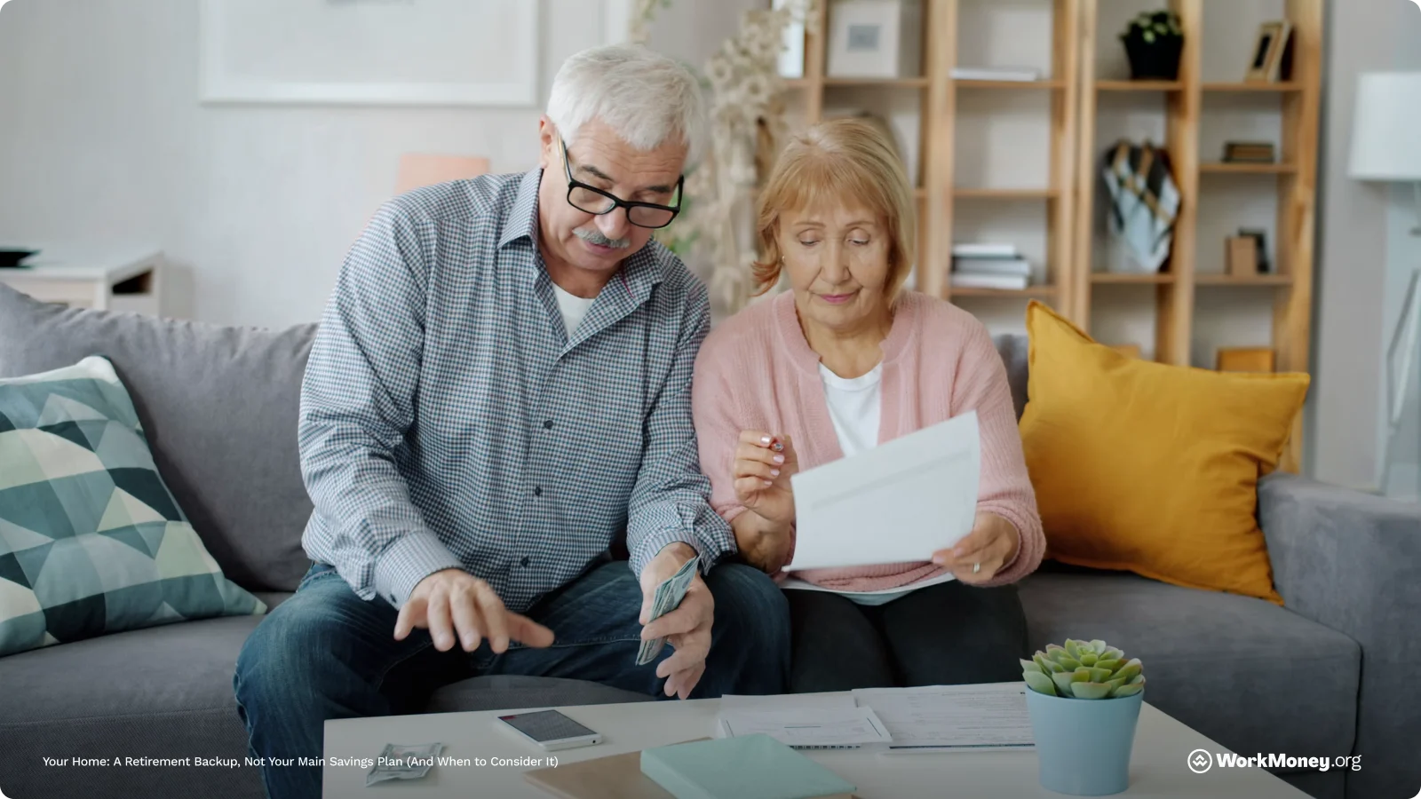 An older couple look at documents together.