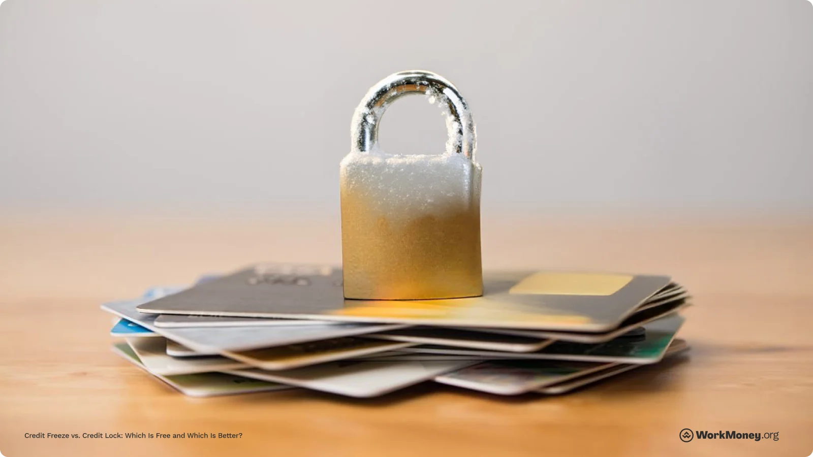 Frozen lock on top of a stack of credit cards
