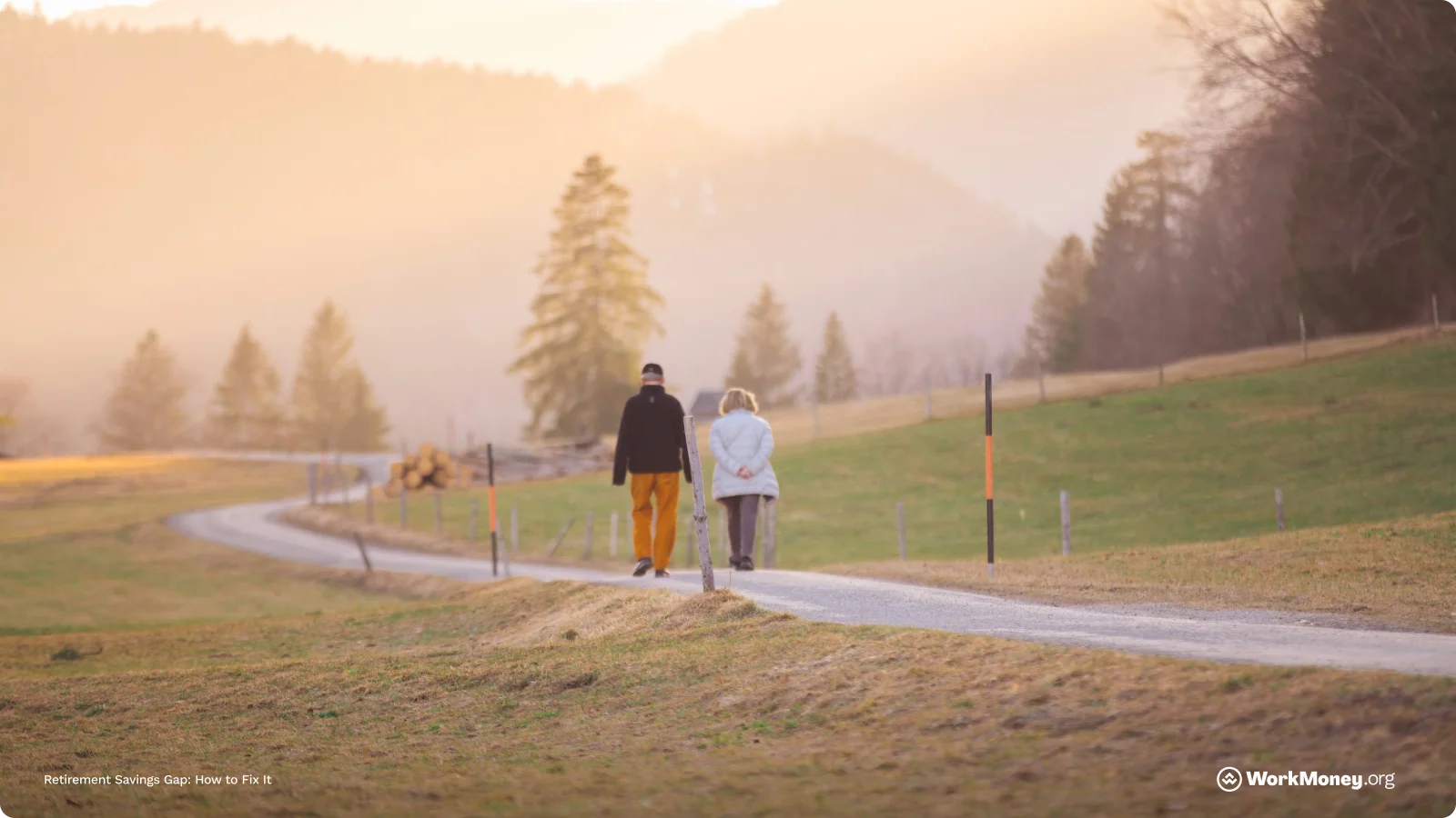 Couple walk in sunset on a trail