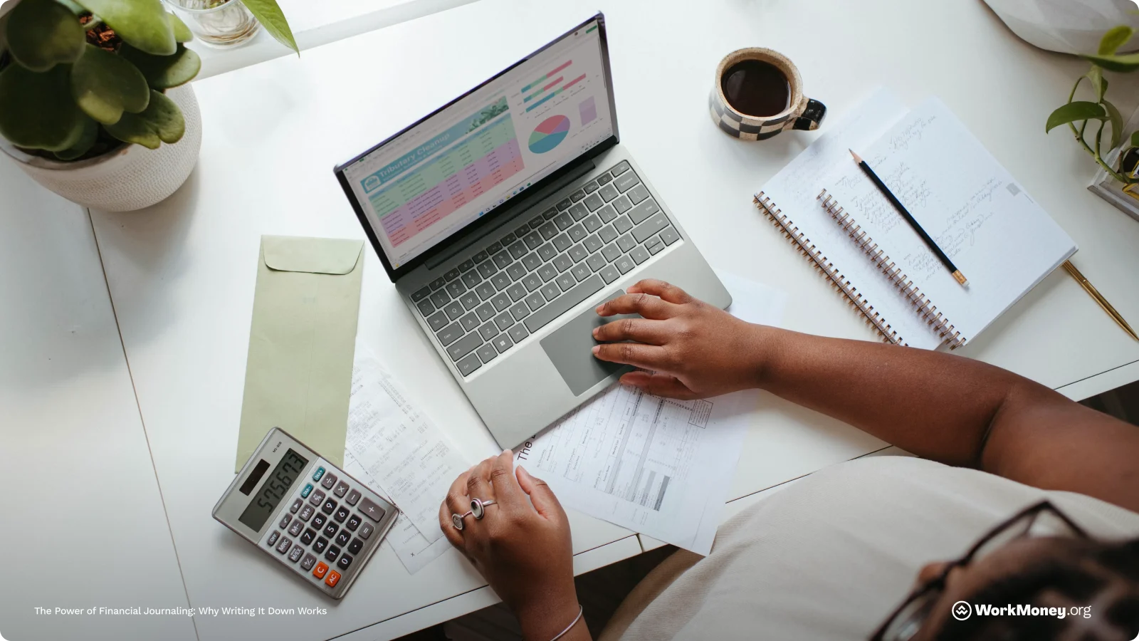 A man types on his laptop as he looks at some investments.