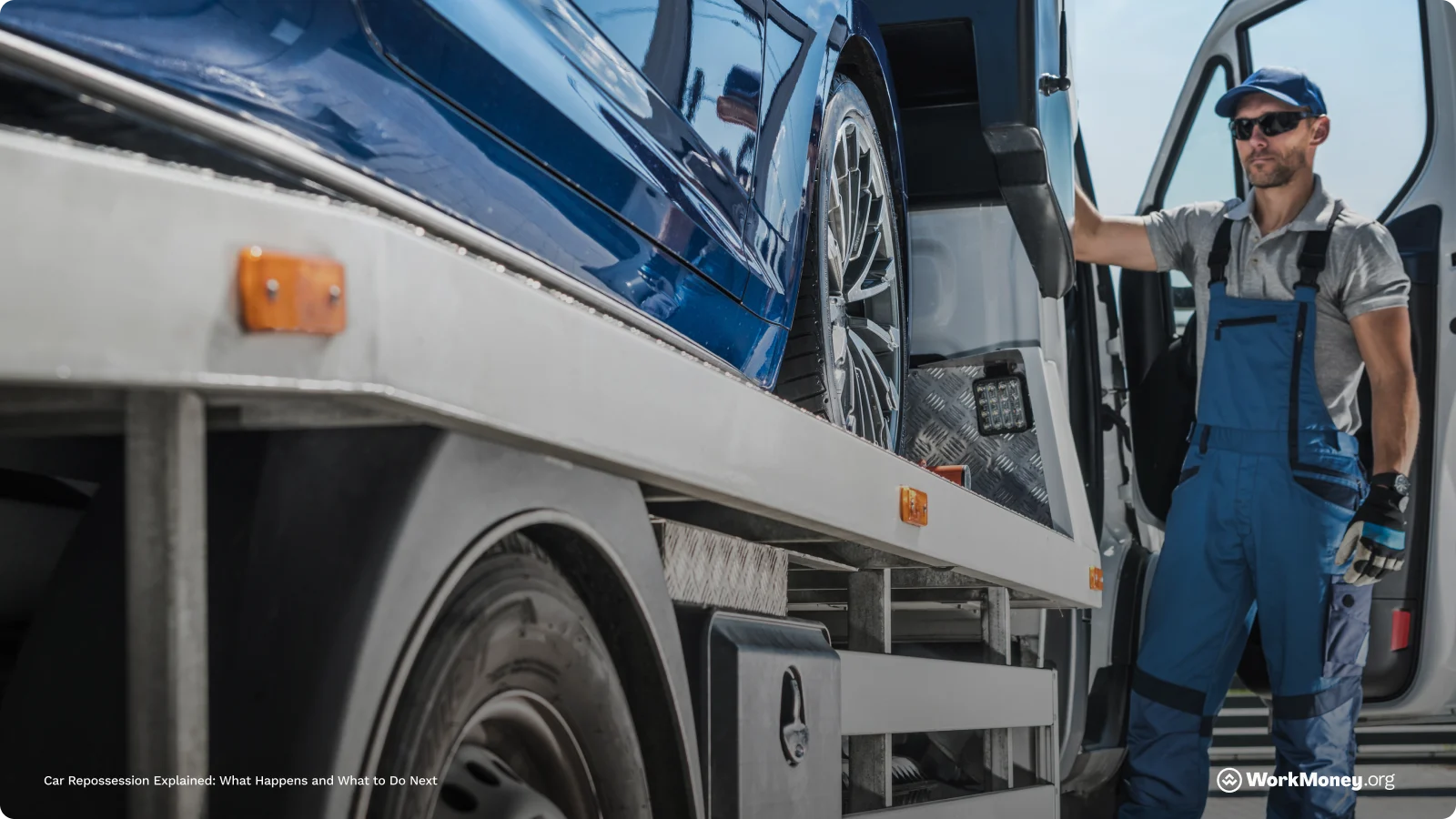 Blue car being towed by a tow truck