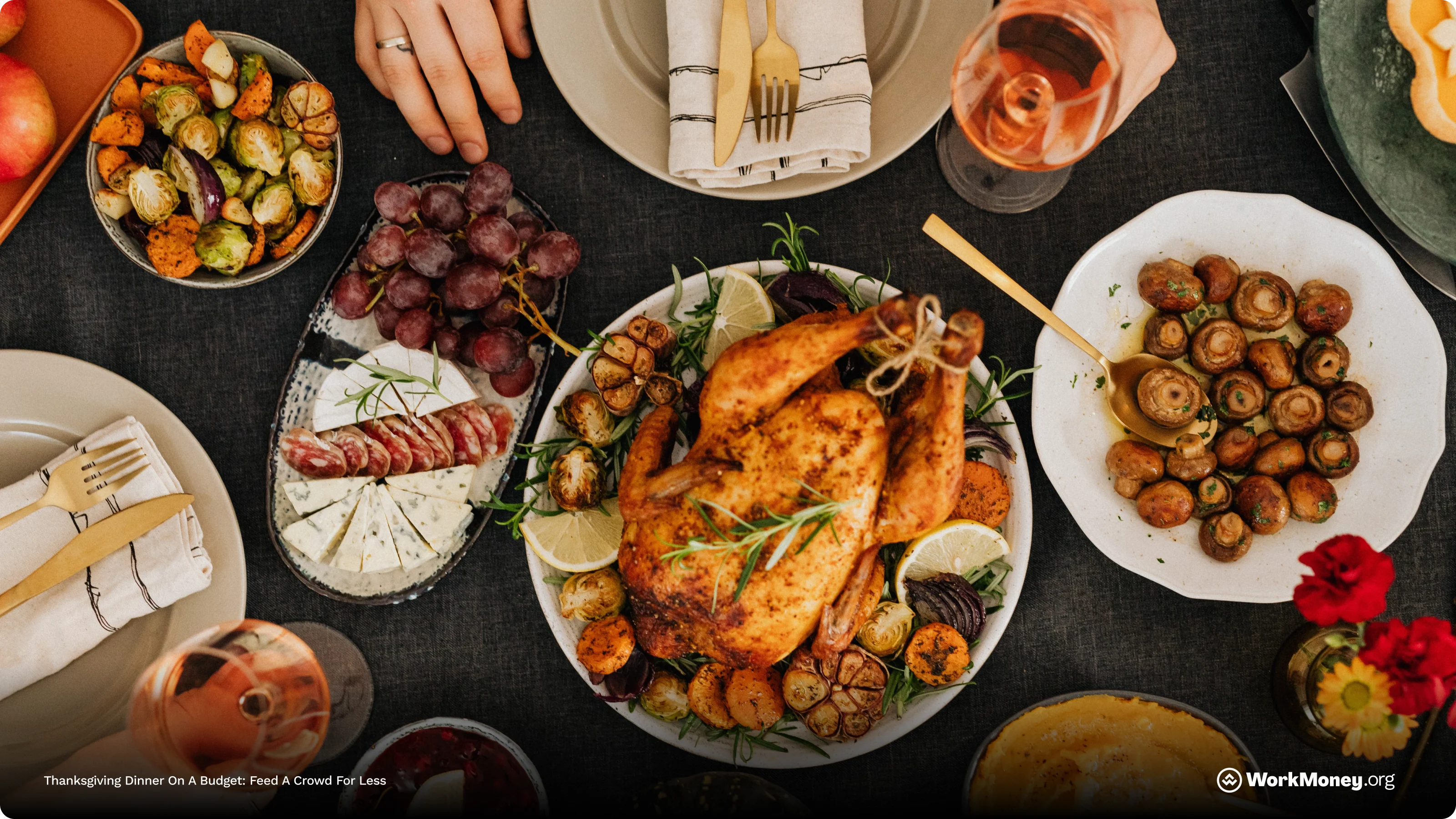 A meal is laid out for Thanksgiving with turkey, potatoes and other foods around.