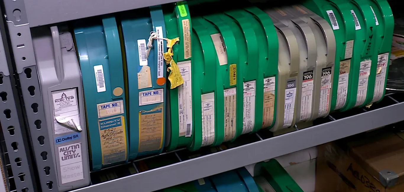 Several two-inch quad tapes of recordings of episodes of Austin City Limits TV show sit on a shelf in an archive room at Austin PBS. (KXAN Photo/Ed Zavala)