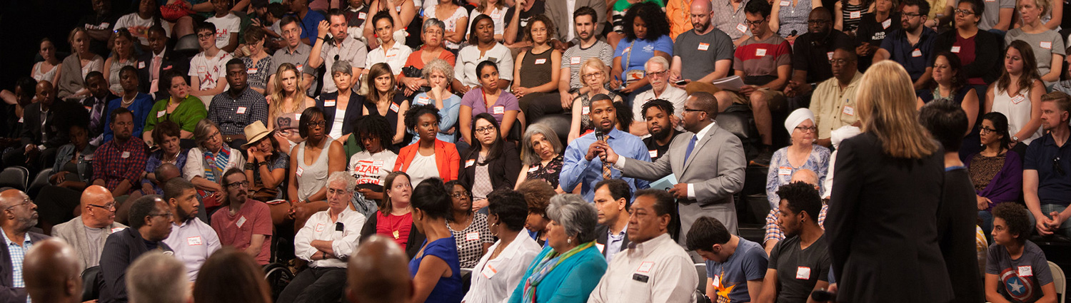 A group of people attending an ATX Together Town Hall at the Austin PBS Studio 6A.