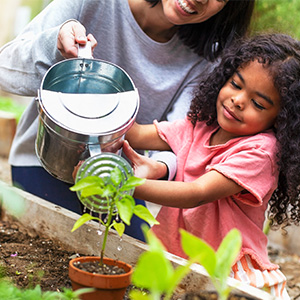 Child watering plants