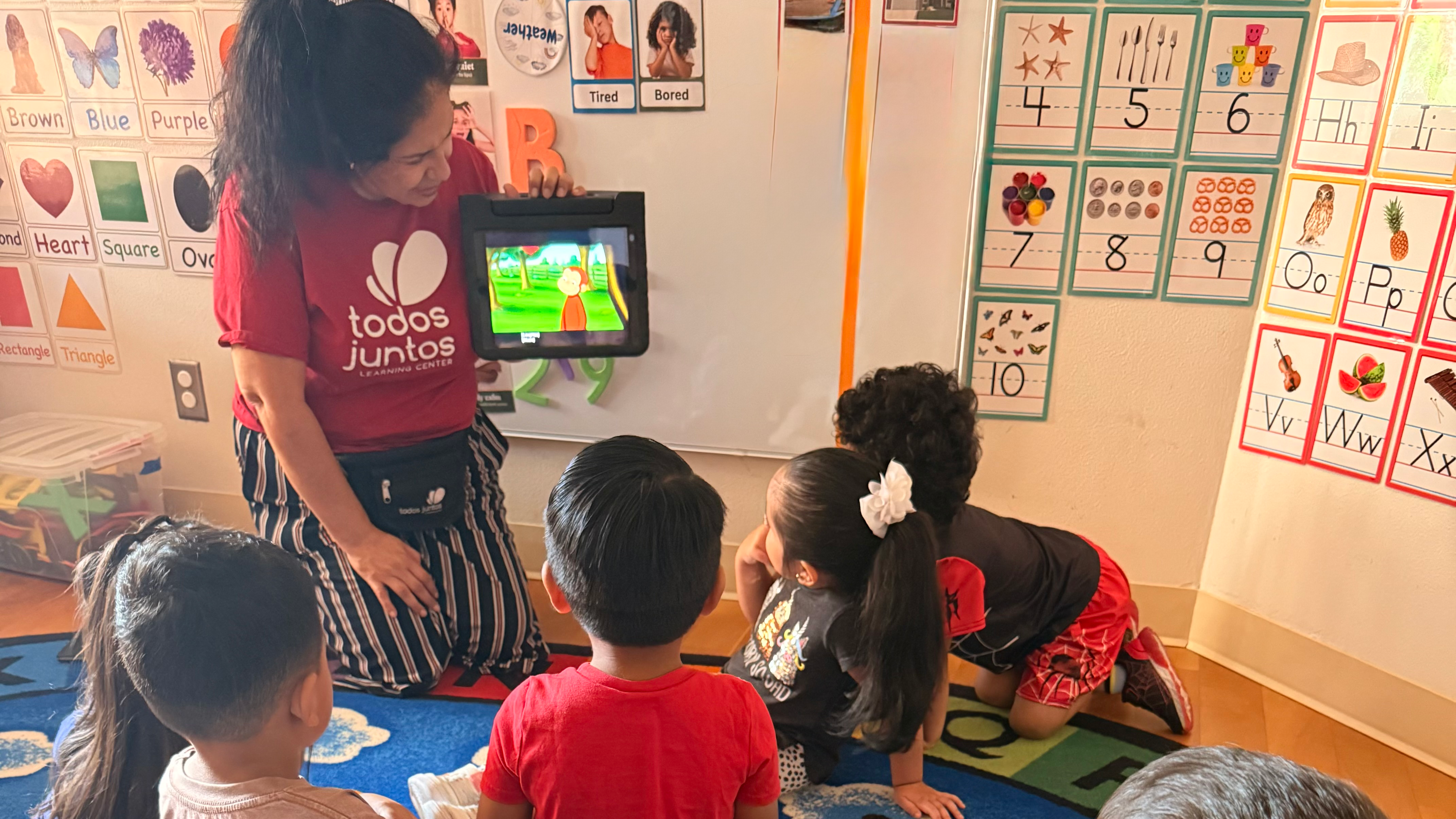 Educator teaches a group of young students