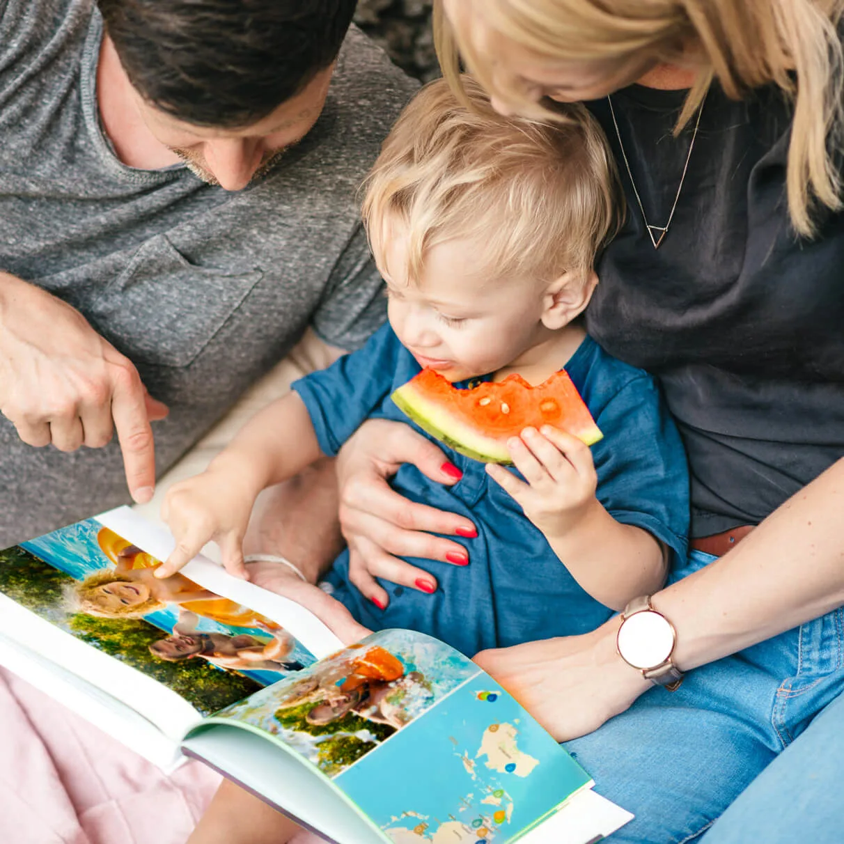 Family picnic with photo book