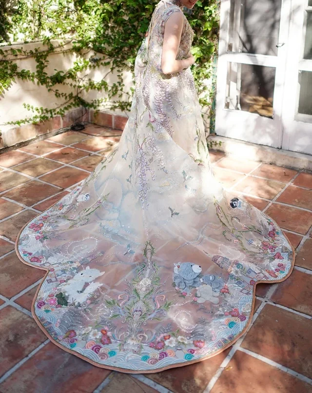 The cape contains hidden details and Easter eggs, like a stuffed bear from a first date.