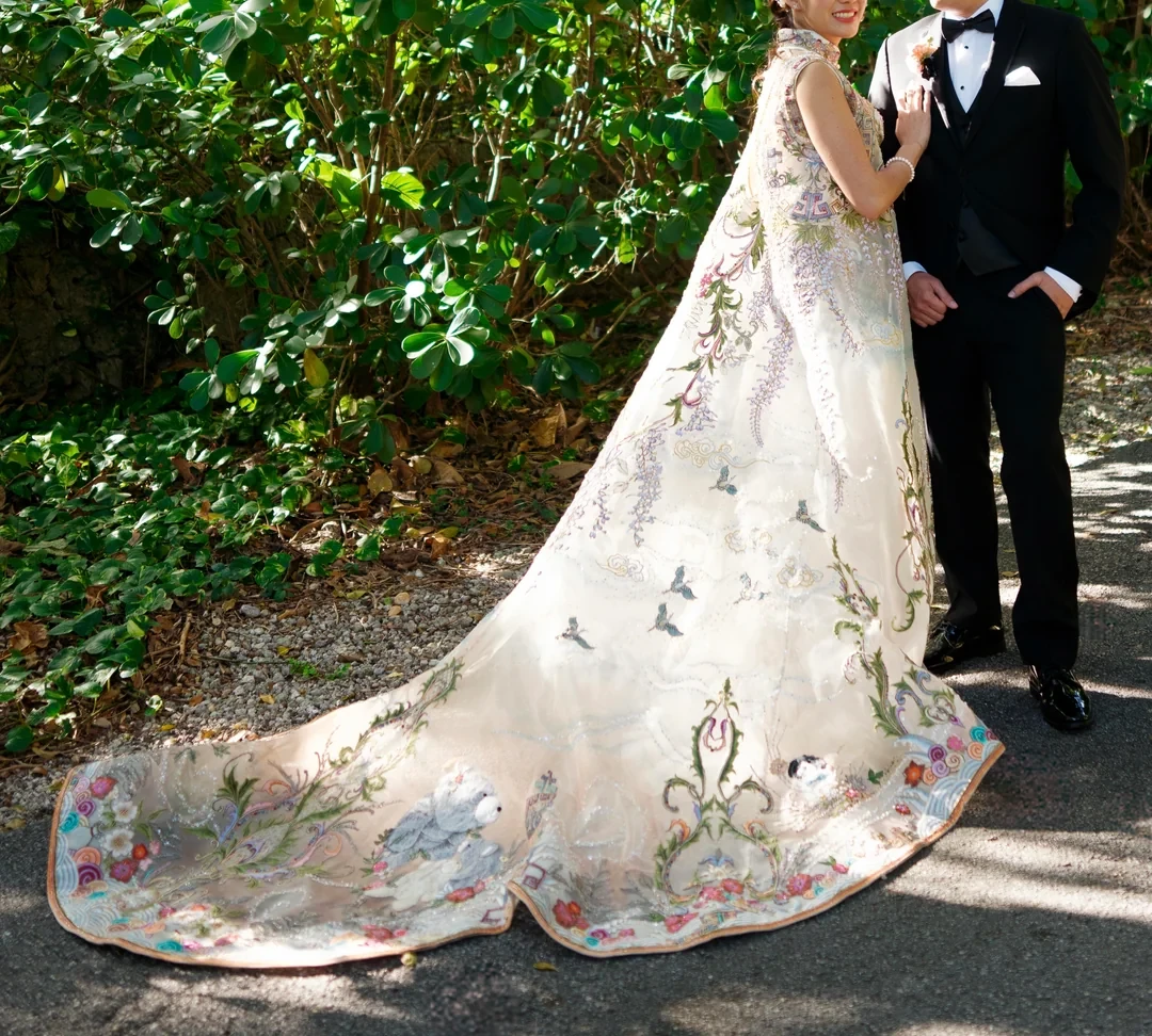 This custom-made dress and cape are layered with colorful flowers and hidden Easter eggs.