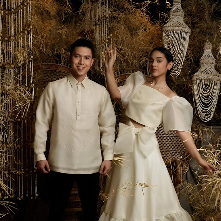 Couple wearing modern barong and terno. Source: https://www.kulturafilipino.com/blogs/news/how-to-style-modern-filipiniana-and-barong-for-formal-events