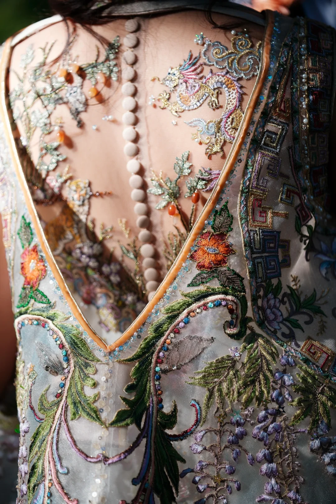 Family symbols and personal Easter eggs are layered onto this Asian-inspired custom wedding dress. Photo by Ramses Garcia.