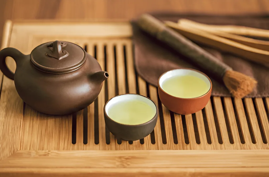 Gongfu Tea Ceremony Set Up with Oolong Tea. Source: https://www.shutterstock.com/image-photo/gongfu-ceremony-oolong-tea-teapot-two-1412887718?trackingId=34f2aa40-dbde-4672-b6ce-1d7d5f426650