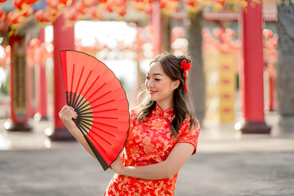 Chinese woman in traditional cheongsam dress. Source: https://www.istockphoto.com/photo/happy-lunar-chinese-new-year-festival-beautiful-lady-wearing-traditional-cheongsam-gm1455770497-491009660?searchscope=image%2Cfilm