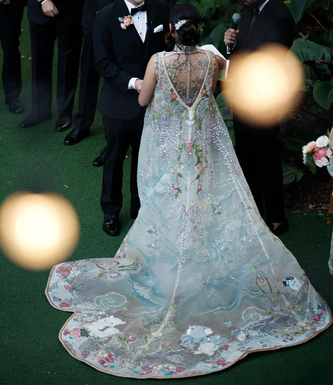 Hand-painted, dusky blue clouds grow visible on the cape as the sun sets.