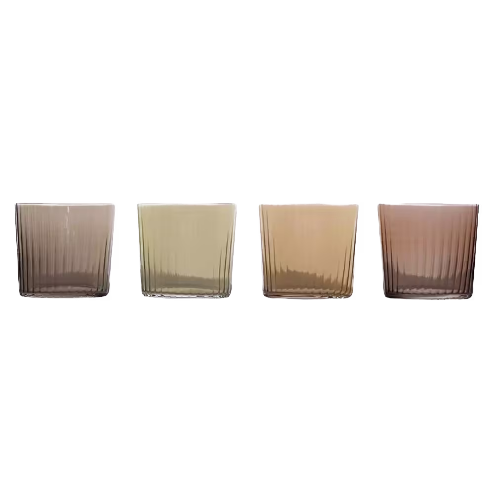 Four glasses with varying shades of chai, from light beige to medium brown, displayed against a black background.