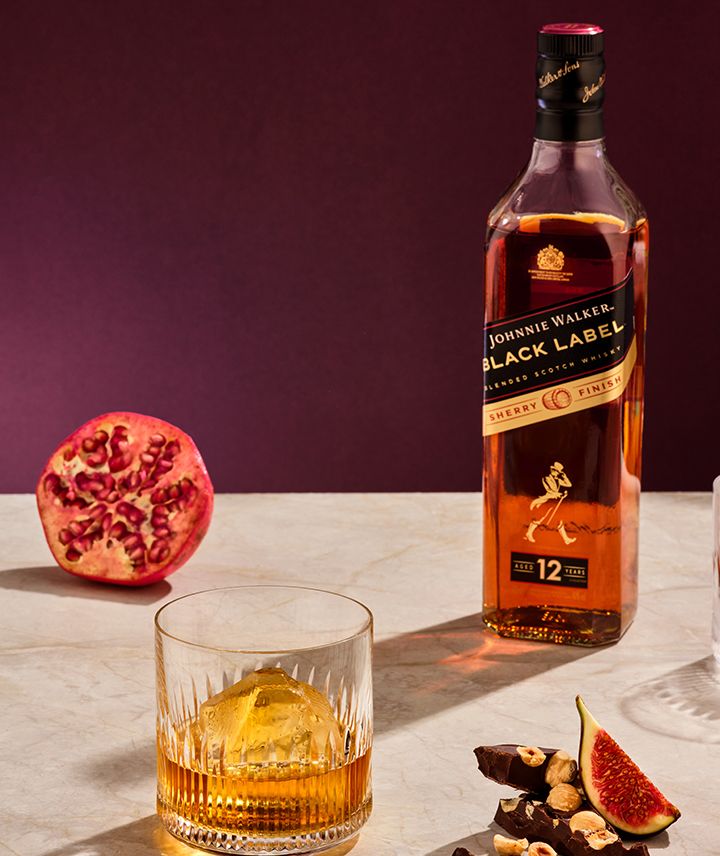 Johnnie Walker Black Label Sherry Finish With Glass on Table