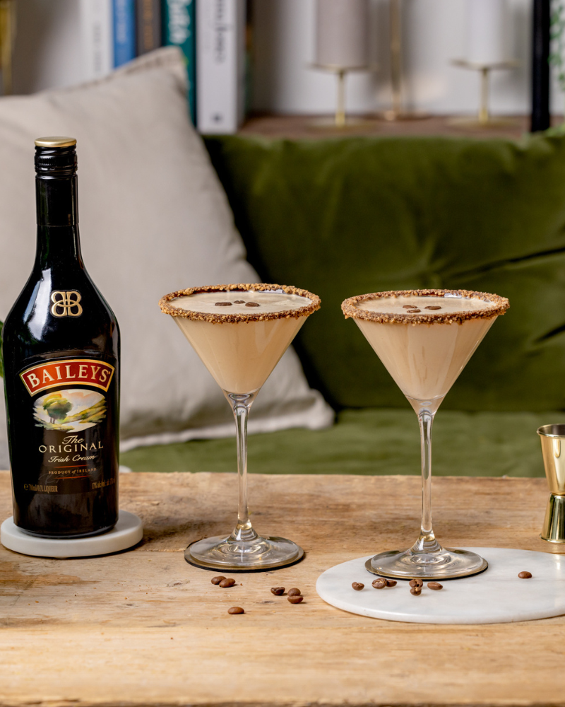 Two Baileys flat white martinis with coffee bean garnishes.