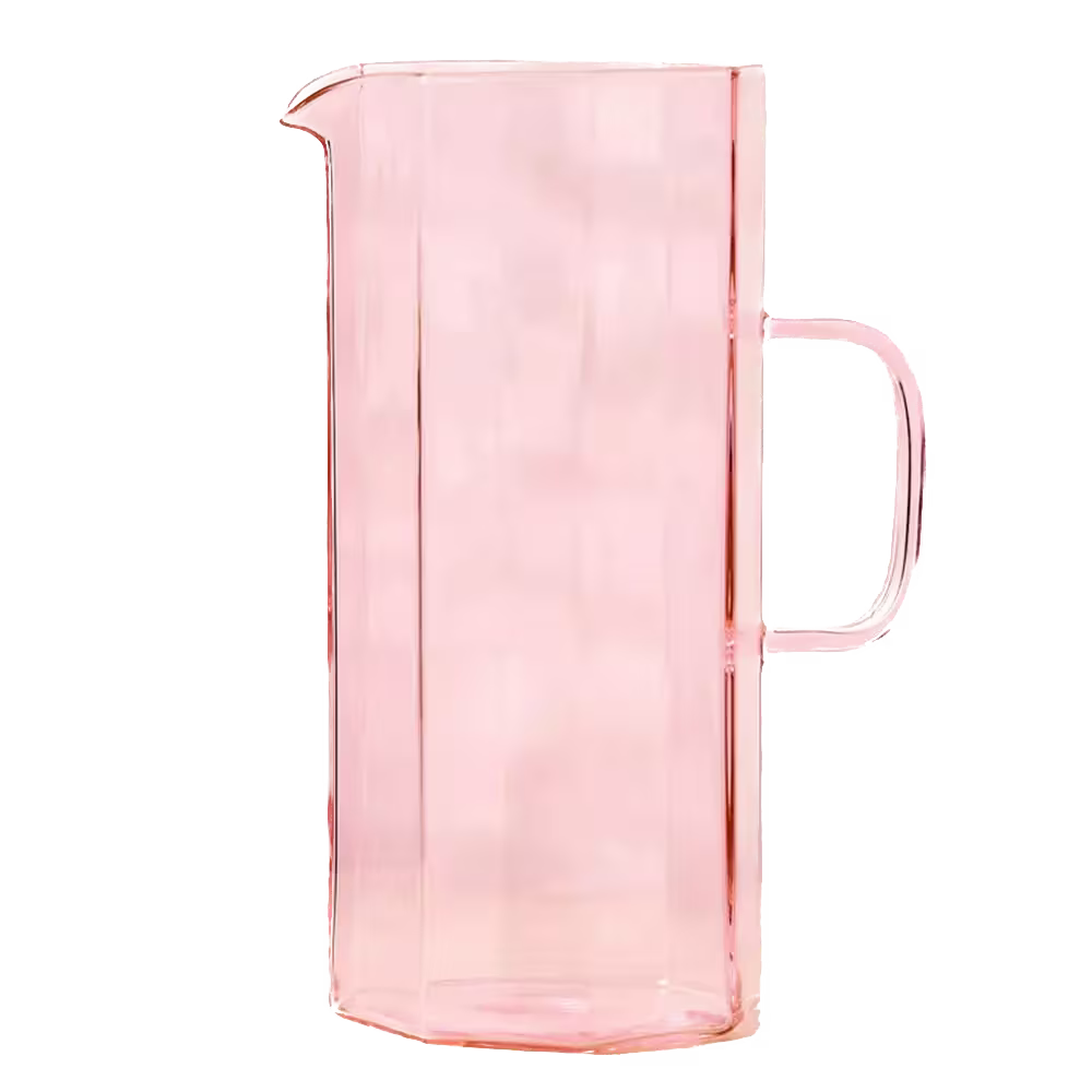 A tall, rectangular pink glass pitcher with a handle and a spout, shown against a plain background.
