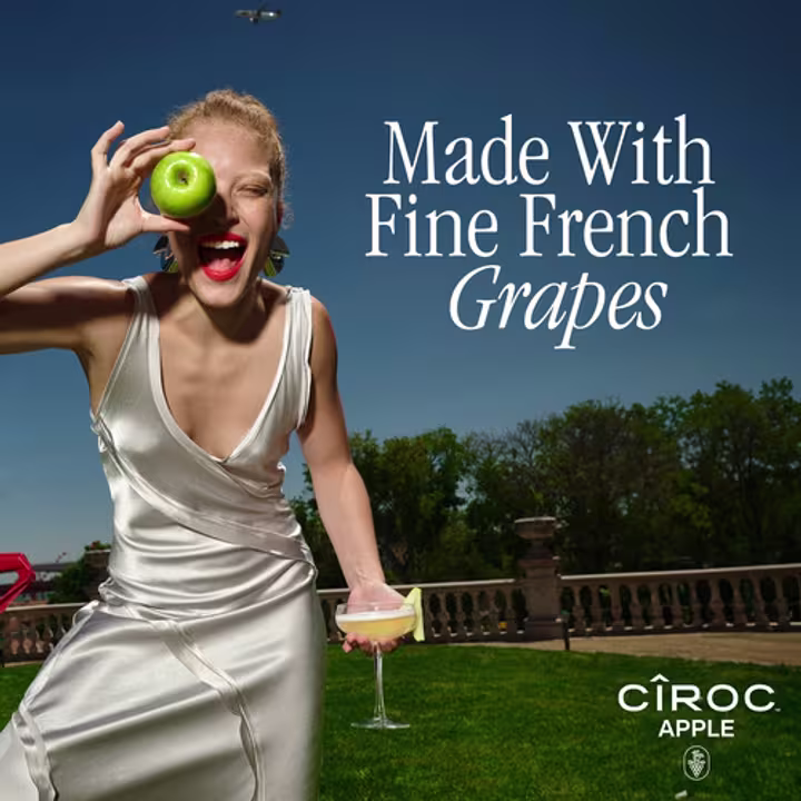 Person holding apple and CÎROC Apple cocktail