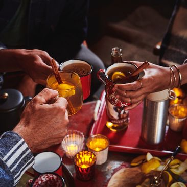 Group of people drinking spiced hot toddys