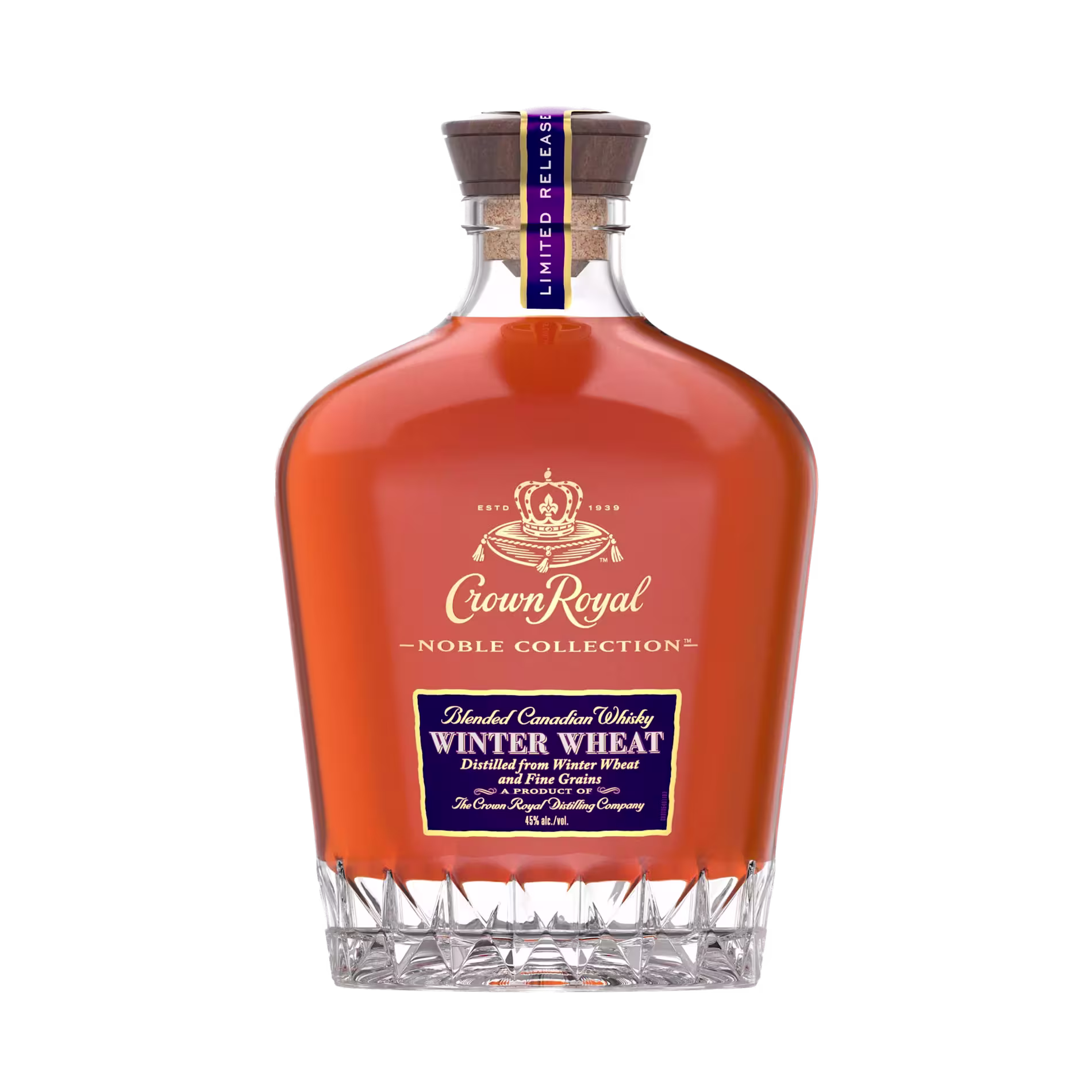 A bottle of Crown Royal Noble Collection Winter Wheat whisky with a clear glass base and label indicating it is a limited release.