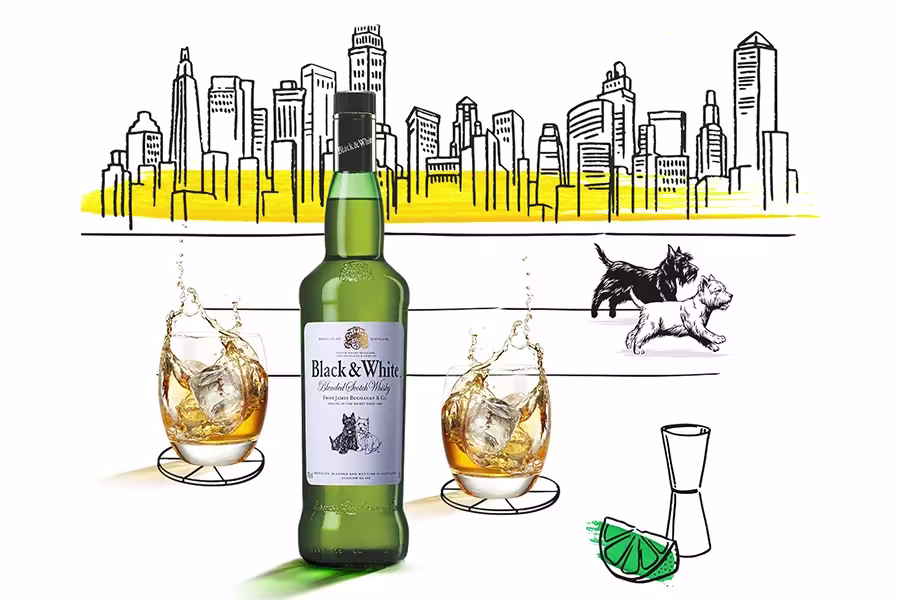 A bottle of Black & White Scotch whisky is placed between two glasses filled with whisky and ice, with a city skyline and two dogs in the background.