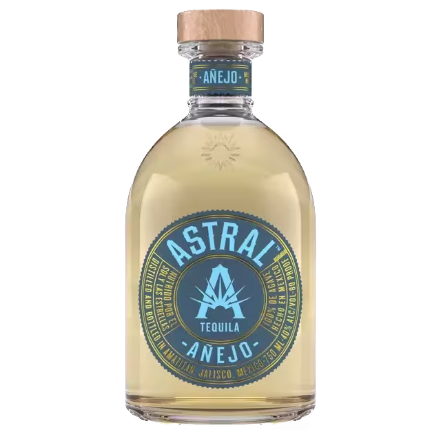 A bottle of Astral Añejo Tequila with a blue and gold label, wooden cap, and the brand name prominently displayed on the front.