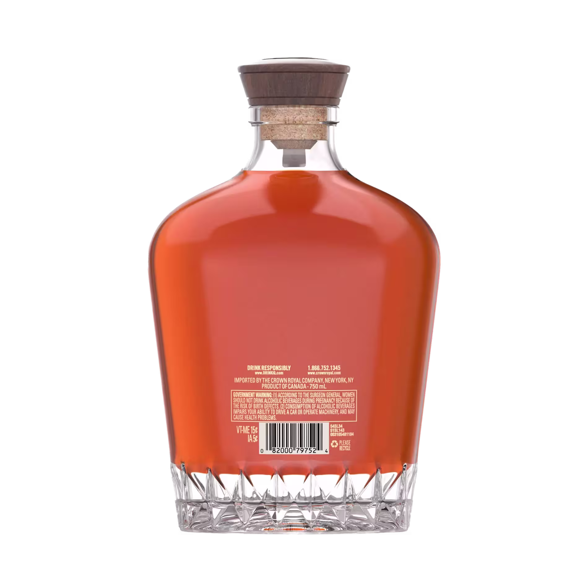 A clear glass decanter filled with amber liquid, sealed with a wooden cork; a barcode and product information are printed on the back label.
