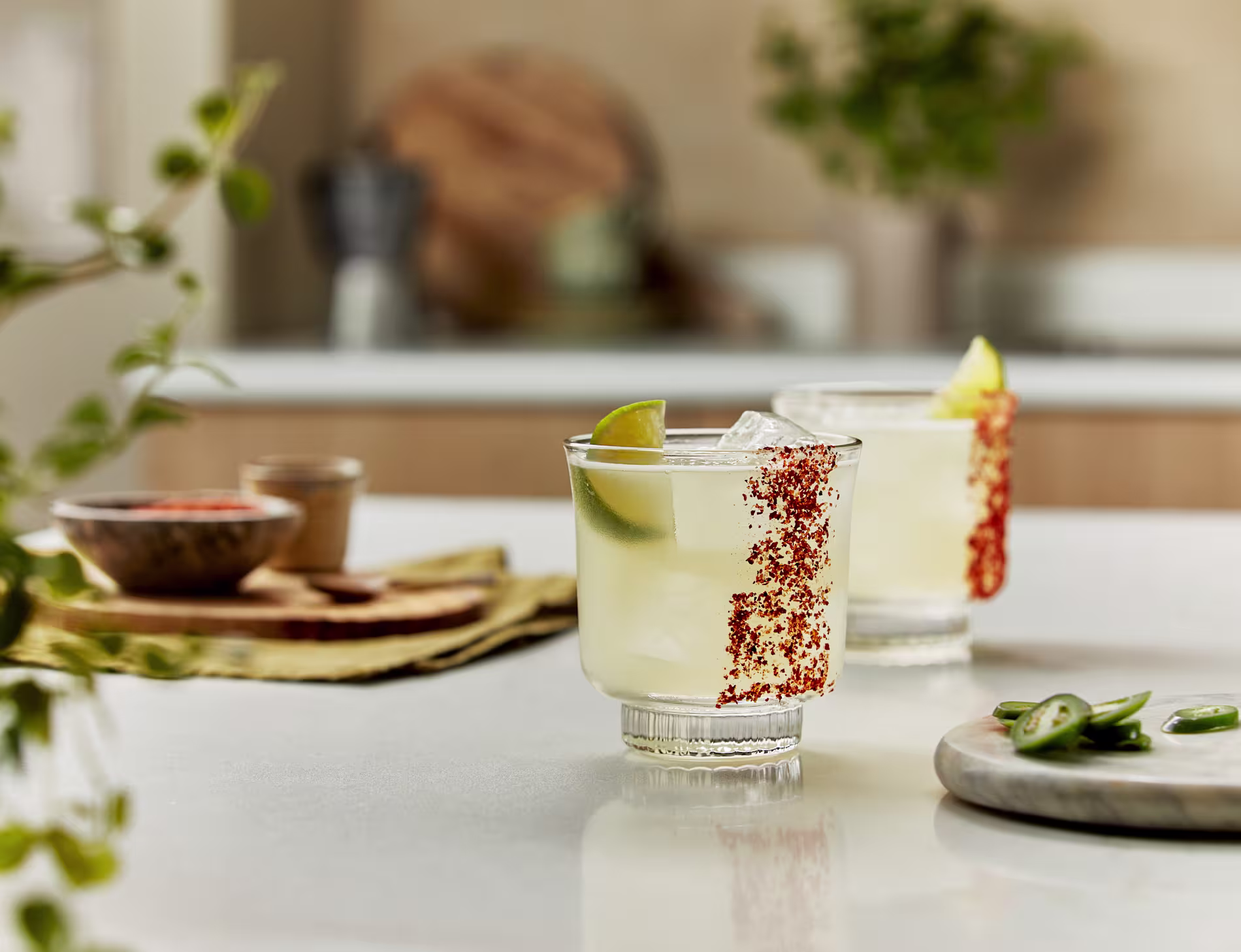 Elegant cocktail with a dried citrus garnish on a wooden table in warm lighting