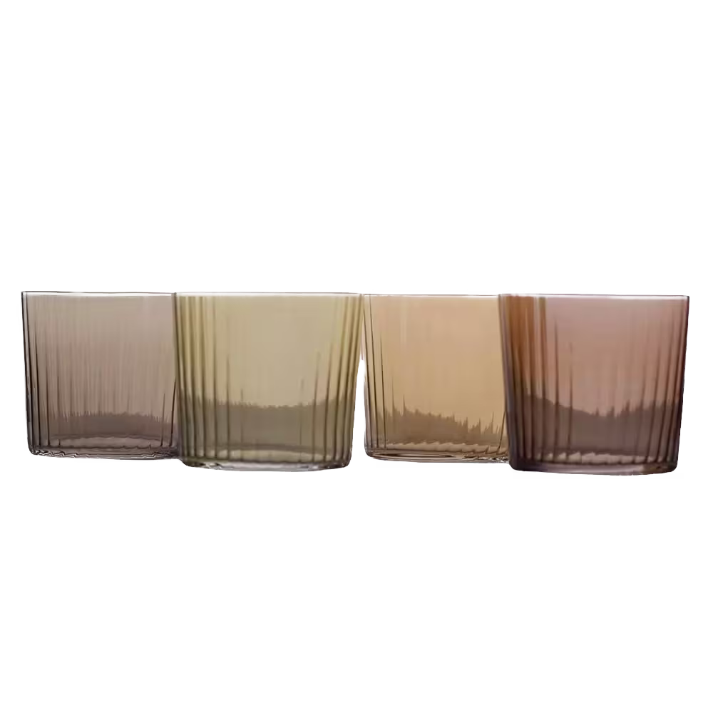 Four ribbed drinking glasses in gradient shades of brown and amber are lined up side by side against a black background.