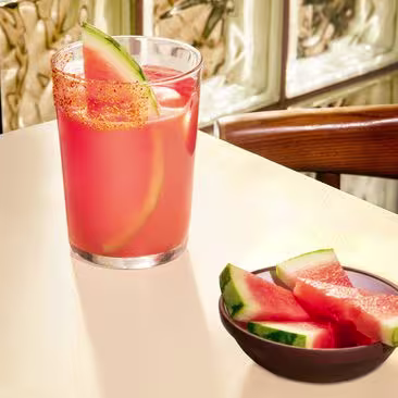 Watermelon Margarita drink with slices of watermelon