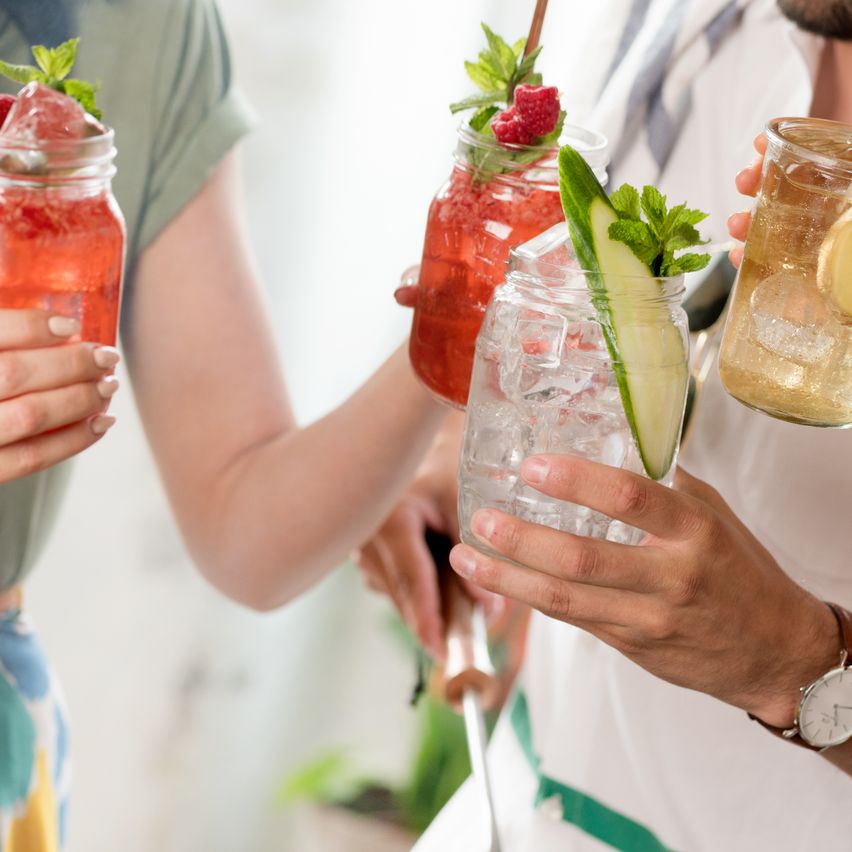 People drinking cocktails at a summer party